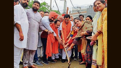 MLA Madan Lal Bagga inaugurating the road project in Ludhiana on Tuesday. (HT Photo)