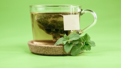 Drink green tea instead of caffeinated drinks: Avoid drinking caffeinated tea or coffee and swap it with a cup of green tea. It helps boost metabolism and keeps the digestive system clean. (Unsplash)