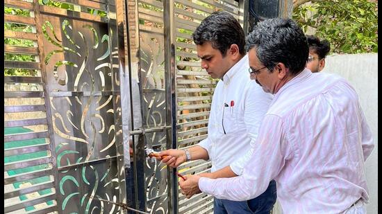 District town planner Amit Madholia sealing a flat in Gurugram on Tuesday. (Sourced)