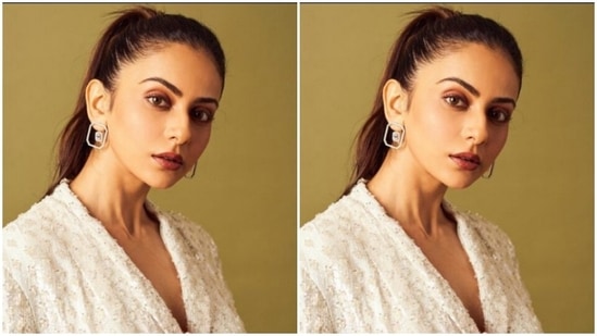 Rakul Preet teamed a white blazer that came with a belt detail at the waist and decorations in silver threads with a pair of white formal trousers.(Instagram/@rakulpreet)