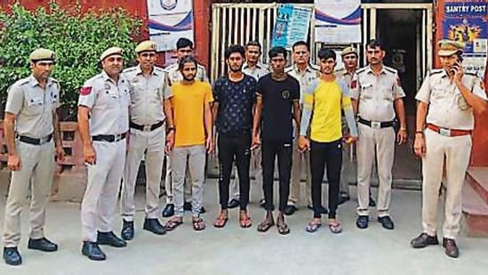 The four arrested men with the police on Tuesday. The four arrested men with the police on Tuesday.