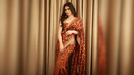 Mouni Roy teamed her look with a matching sleeveless blouse and statement gold earrings. Her outfit is from the clothing house of Drishti &amp; Zahabia.(Instagram/@imouniroy)