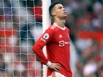 Cristiano Ronaldo rests against a goalpost during a Premier League match.