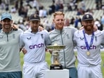 England's captain Ben Stokes, second right, and teammates pose after their win the fifth cricket test match against India at Edgbaston in Birmingham, Eng land, Tuesday, July 5, 2022.