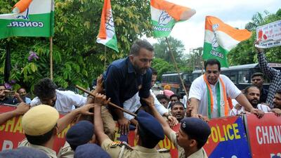 Congress workers trying to break past police barricading during the protest at Sector 35, Chandigarh. (Ravi Kumar/HT) Congress workers trying to break past police barricading during the protest at Sector 35, Chandigarh. (Ravi Kumar/HT)