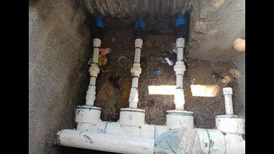 Home owners have bypassed water meters through U pipes to change course of water into other pipelines. (In pic) The main pipeline at the bottom has three unauthorised lines with blue connection valves. (HT PHOTO) Home owners have bypassed water meters through U pipes to change course of water into other pipelines. (In pic) The main pipeline at the bottom has three unauthorised lines with blue connection valves. (HT PHOTO)