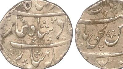 Reverse of Poona Muhiyabad silver coin minted at Puna in the name of Shah Alam II by Peshwas with Parshu mark. (Courtesy: Marudhar arts) Reverse of Poona Muhiyabad silver coin minted at Puna in the name of Shah Alam II by Peshwas with Parshu mark. (Courtesy: Marudhar arts)