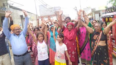 Residents of Ambedkar Nagar during protest outside the office of councillor over erratic water supply, in Ludhiana on Wednesday. (HT PHOTO)