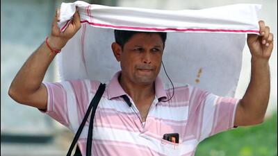A man covers his head to protect from the sun on a hot summer day in New Delhi. (ANI Photo) A man covers his head to protect from the sun on a hot summer day in New Delhi. (ANI Photo)