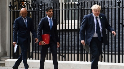 From left, British Health Secretary Sajid Javid, Chancellor of the Exchequer Rishi Sunak and Prime Minister Boris Johnson arrive at No 9 Downing Street for a media briefing on May 7, 2021.&nbsp; (AP)