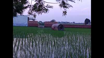A part of the boiler which fell into a field adjacent to the factory following the explosion at the factory in Ludhiana. (HT Photo)