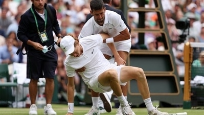 Novak Djokovic helps Jannik Sinner during their match at Wimbledon (Getty) Novak Djokovic helps Jannik Sinner during their match at Wimbledon (Getty)