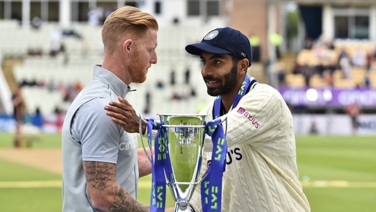 England's captain Ben Stokes, left, and India's captain Jasprit Bumrah shake hands after receiving the winners trophy after England won the fifth cricket test match at Edgbaston in Birmingham.(AP)