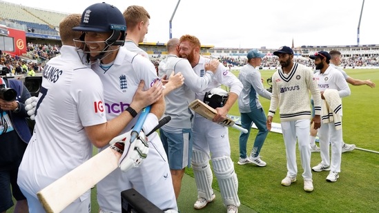 Jonny Bairstow and with Joe Root celebrate with teammates after winning the match(Reuters)