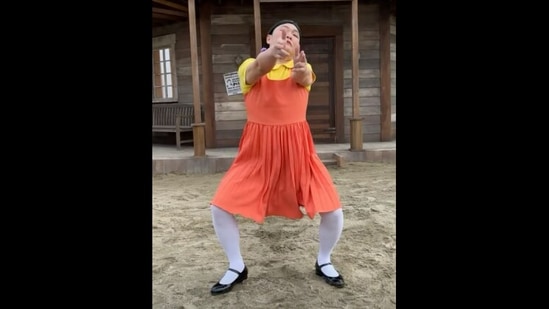 Psy dances to That That by him and BTS' Suga, dressed as the creepy Squid Game doll. (Instagram/@42psy42) Psy dances to That That by him and BTS' Suga, dressed as the creepy Squid Game doll. (Instagram/@42psy42)