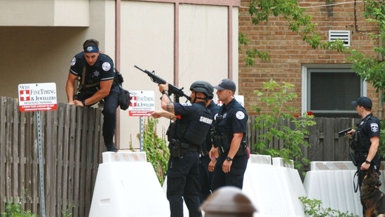 At least six people were killed and around 30 wounded on July 4 when a gunman opened fire from a rooftop at a Fourth of July parade in the Chicago suburb of Highland Park.(AFP) At least six people were killed and around 30 wounded on July 4 when a gunman opened fire from a rooftop at a Fourth of July parade in the Chicago suburb of Highland Park.(AFP)