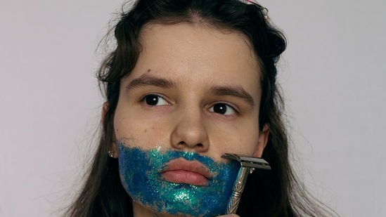 Start at the bottom: Shave against the hair growth to avoid those pesky nicks. When your are shaving your legs, always start from the bottom and then go upwards.(Unsplash)