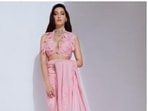 Nora Fatehi blends elegance and sass in a pink satin saree