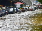 Mumbai: Vehicles ply on a waterlogged street after heavy rainfall in Mumbai.