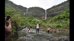 Tourists at Pandavkada waterfalls. <span class='webrupee'>₹</span>10Cr has been allocated for developing the waterfalls by the MVA government last month. However, activists are sceptical of the funds being used for the development. (BACHCHAN KUMAR/HT PHOTO) Tourists at Pandavkada waterfalls. <span class='webrupee'>₹</span>10Cr has been allocated for developing the waterfalls by the MVA government last month. However, activists are sceptical of the funds being used for the development. (BACHCHAN KUMAR/HT PHOTO)