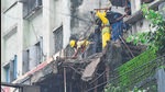 BMC workers removing the balance portion of the wall of a dilapidated structure during a two-hour emergency block (Bhushan Koyande) BMC workers removing the balance portion of the wall of a dilapidated structure during a two-hour emergency block (Bhushan Koyande)