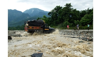 A jeep ferries traders to the village of Totopara, home to the Toto tribe of West Bengal. The village is in a remote area near the border with Bhutan. These jeeps transport the traders from the nearest town, Madarihat, 24 km away, along a route that winds across six river beds. In the monsoons, Totopara becomes inaccessible. (Abhijit AA / Totos of Totopara) A jeep ferries traders to the village of Totopara, home to the Toto tribe of West Bengal. The village is in a remote area near the border with Bhutan. These jeeps transport the traders from the nearest town, Madarihat, 24 km away, along a route that winds across six river beds. In the monsoons, Totopara becomes inaccessible. (Abhijit AA / Totos of Totopara)