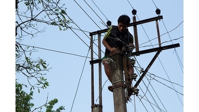 A Toto man climbs an electric pole to fix a broken wire. Given their remote and mountainous location, power outages caused by storms and bad weather are a common occurrence, so the Totos have learned to do fix some glitches themselves. (Abhijit AA / Totos of Totopara) A Toto man climbs an electric pole to fix a broken wire. Given their remote and mountainous location, power outages caused by storms and bad weather are a common occurrence, so the Totos have learned to do fix some glitches themselves. (Abhijit AA / Totos of Totopara)