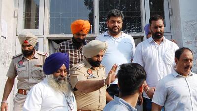 Congress Leader and Amritsar Improvement Trust former chairman Dinesh Bassi (centre) denied any wrongdoing and alleged political vendetta while coming out of court on Thursday. (Sameer Sehgal/HT) Congress Leader and Amritsar Improvement Trust former chairman Dinesh Bassi (centre) denied any wrongdoing and alleged political vendetta while coming out of court on Thursday. (Sameer Sehgal/HT)