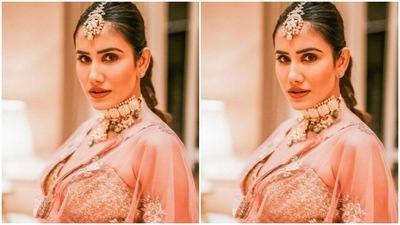 Sonnalli played muse to fashion designer house Pawan and Pranav Haute Couture and picked a golden lehenga from the shelves. (Instagram/@sonnalliseygall)