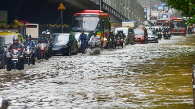 Mumbai: Vehicles ply on a waterlogged street after heavy rainfall in Mumbai. (PTI) Mumbai: Vehicles ply on a waterlogged street after heavy rainfall in Mumbai. (PTI)