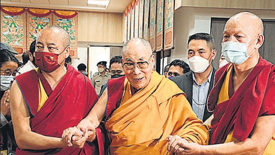 Tibetan spiritual leader Dalai Lama (C) is assisted as he arrives for the inaguaration of a museum on his 87th birthday, in Dharamsala on Wednesday. (AFP)