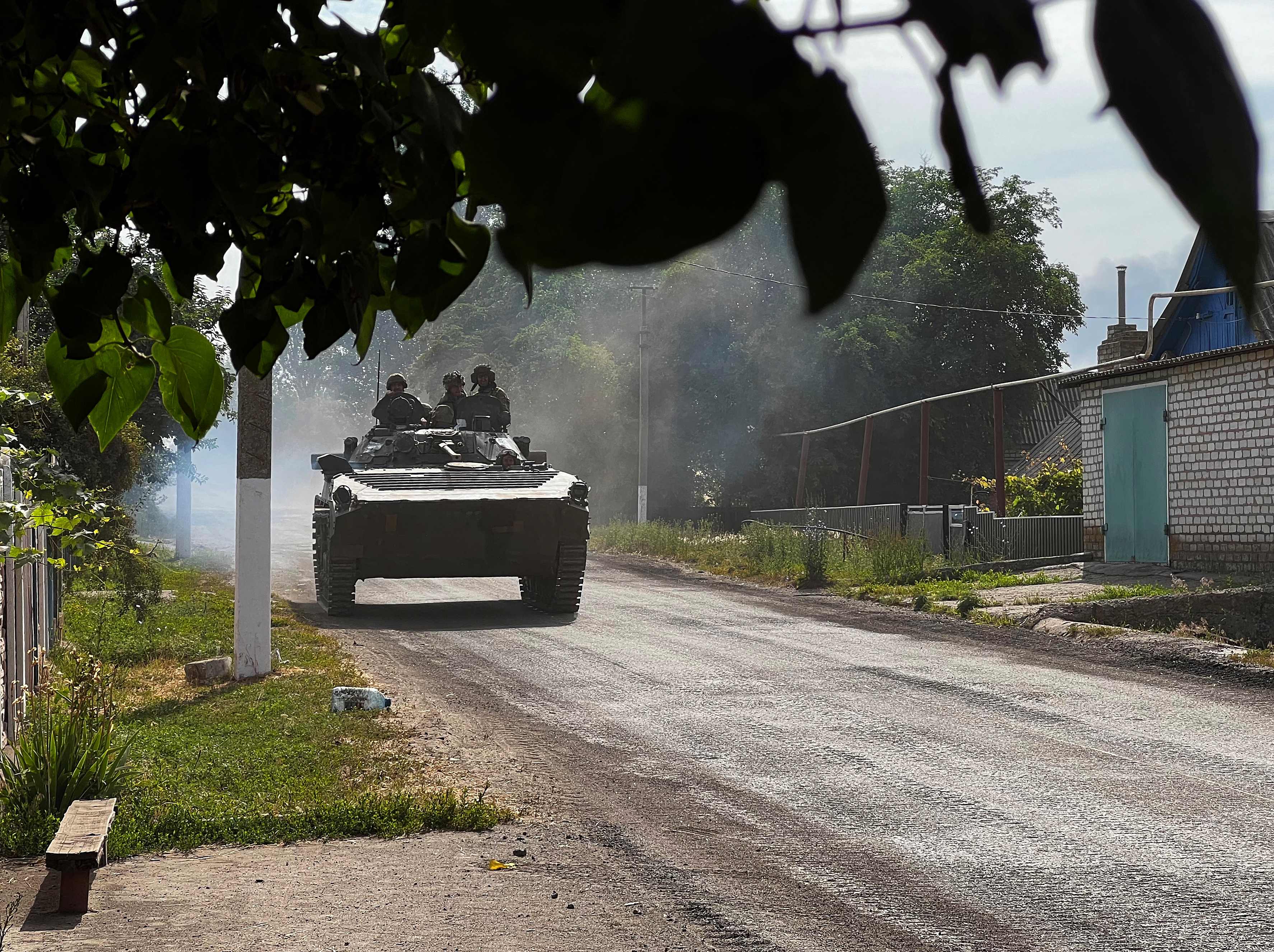 Ukrainian soldiers ride an armoured vehicle on the main road to Lysychansk in Ukraine�s eastern region of Donbas on June 26, 2022. (AFP) Ukrainian soldiers ride an armoured vehicle on the main road to Lysychansk in Ukraine�s eastern region of Donbas on June 26, 2022. (AFP)