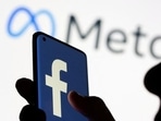 Woman holds smartphone with Facebook logo in front of a displayed Facebook's new rebrand logo Meta in this illustration picture (REUTERS File Photo) Woman holds smartphone with Facebook logo in front of a displayed Facebook's new rebrand logo Meta in this illustration picture (REUTERS File Photo)