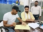 Saha signs the documents as he will join the Tripura cricket team as a player-cum-mentor during a press meet, in Agartala on Friday. Saha signs the documents as he will join the Tripura cricket team as a player-cum-mentor during a press meet, in Agartala on Friday.