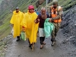 Administration trying to give safe passage to pilgrims after flash floods triggered by cloudburst near Amarnath Cave(ANI Photo) Administration trying to give safe passage to pilgrims after flash floods triggered by cloudburst near Amarnath Cave(ANI Photo)