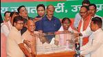 Chief minister Yogi Adityanath presenting a model of Ayodhya’s Ram temple to NDA presidential candidate Droupadi Murmu, in Lucknow on Friday. (HT PHOTO) Chief minister Yogi Adityanath presenting a model of Ayodhya’s Ram temple to NDA presidential candidate Droupadi Murmu, in Lucknow on Friday. (HT PHOTO)