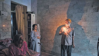 Mumbai, India - July 08, 2022: Harneet Kaur Narula, a resident of the dilapidated Prithvi Punjab CHS building, stays with her parents without electricity and water supply cut by BMC in spite of the structure being declared dangerous and unsafe, at Sion Koliwada, in Mumbai, India, on Friday, July 08, 2022. (Photo by Satish Bate/Hindustan Times) (Satish Bate/HT PHOTO) Mumbai, India - July 08, 2022: Harneet Kaur Narula, a resident of the dilapidated Prithvi Punjab CHS building, stays with her parents without electricity and water supply cut by BMC in spite of the structure being declared dangerous and unsafe, at Sion Koliwada, in Mumbai, India, on Friday, July 08, 2022. (Photo by Satish Bate/Hindustan Times) (Satish Bate/HT PHOTO)