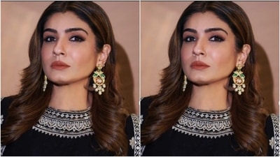 Raveena teamed a black cropped top with white zari details with a white flowy skirt that featured patterns in black prints. She added more drama to her look with a satin black shrug that came intricately embroidered in white threads. (Instagram/@officialraveenatandon)