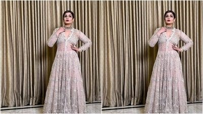 Raveena teamed a white gown with intricate embroidered details in silver resham threads. The translucent gown showed off her midriff and hugged her shape before cascading to her ankles in flowy details with pleats. (Instagram/@officialraveenatandon)