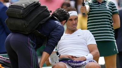 Spain's Rafael Nadal receives treatment just before a medical timeout as he plays Taylor Fritz of the US in a men's singles quarterfinal (AP) Spain's Rafael Nadal receives treatment just before a medical timeout as he plays Taylor Fritz of the US in a men's singles quarterfinal (AP)