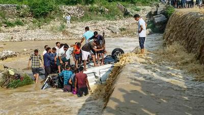 Locals attempt rescue work after a car was washed away by the surging Dhela river at Ramnagar in Uttarakhand’s Nainital district on Friday. (PTI) Locals attempt rescue work after a car was washed away by the surging Dhela river at Ramnagar in Uttarakhand’s Nainital district on Friday. (PTI)