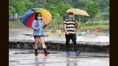 City folks are rushing to the local markets to scout for some monsoon essentials – from umbrellas and raincoats to rain-friendly footwear and waterproof makeup. (Keshav Singh/HT)