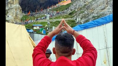 A pilgrim offers prayers at the Amarnath cave temple in Anantnag on Thursday. (ANI Photo) A pilgrim offers prayers at the Amarnath cave temple in Anantnag on Thursday. (ANI Photo)