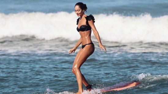 Lisa Haydon shared new photos of her surfing in Bali.