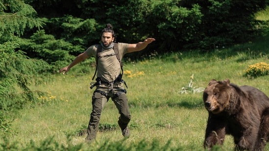 Ranveer Singh running away from a bear in a scene from his Netflix interactive special.