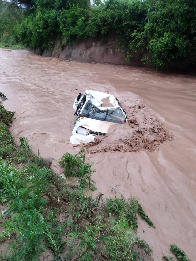 The cab was swept away while the driver was attempting to cross the causeway of a swollen Patiala Ki Rao riuvelt in Nayagaon’s Tanda village on Wednesday. (HT Photo)