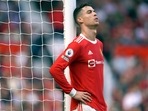 Cristiano Ronaldo rests against a goalpost during the English Premier League soccer match