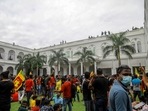Protesters gather inside the premises of Sri Lankan president Gotabaya Rajapaksa's official residence in Colombo.(AP) Protesters gather inside the premises of Sri Lankan president Gotabaya Rajapaksa's official residence in Colombo.(AP)
