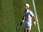Serbia's Novak Djokovic celebrates winning his semi final match against Britain's Cameron Norrie