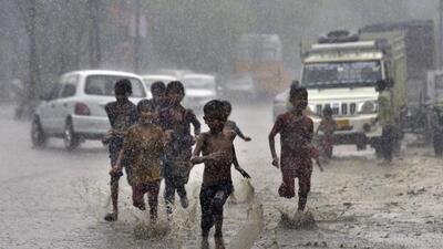 Children enjoying heavy rainfall and relief from the scorching heat in Ludhiana. (Gurpreet Singh/HT)